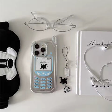 Phone case with loading screen design, glasses, panda mask, and book on a white surface