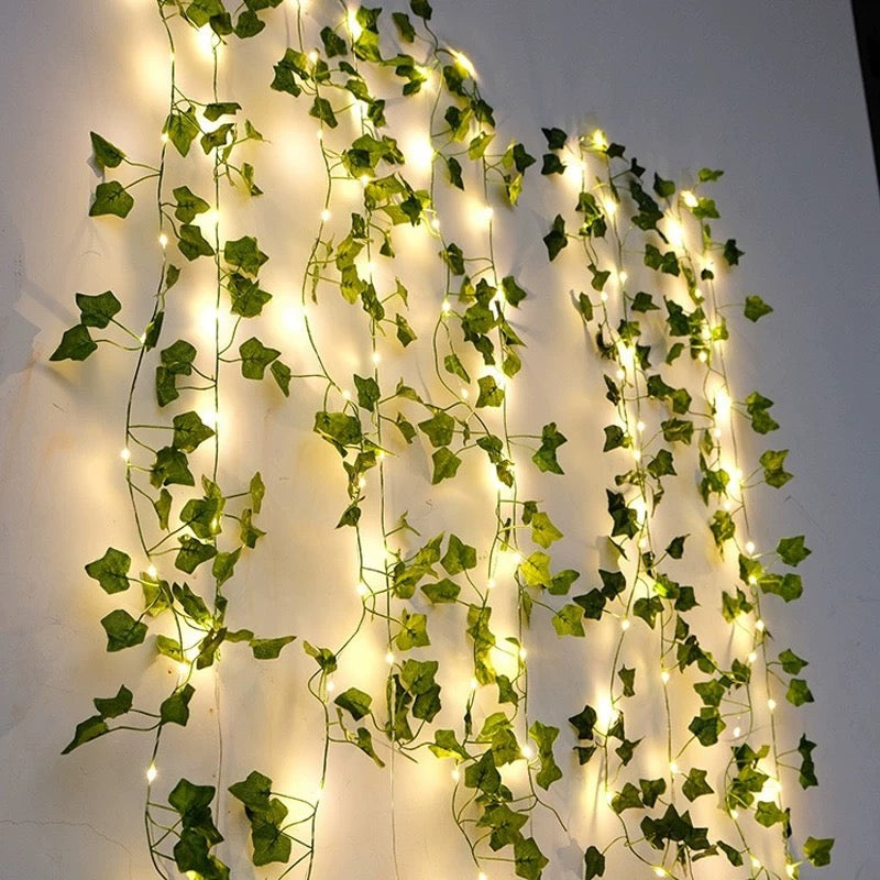 LED string garland styled above a bed frame for dreamy cottagecore ambiance.