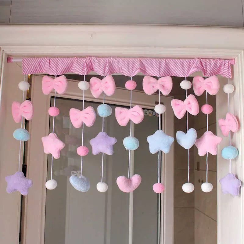 Girly curtain with pink bows and tassels styled for coquette room decor.