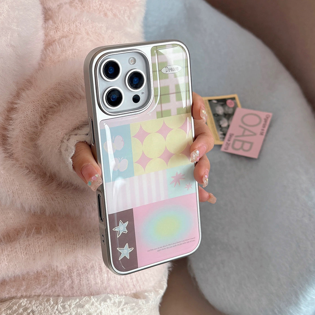 Glossy pastel iPhone case with colorful patchwork design and Korean soft girl aesthetic