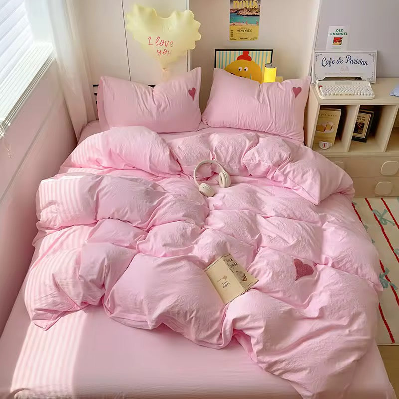 Teen girl's dorm room featuring soft girl aesthetic bedding and decor.