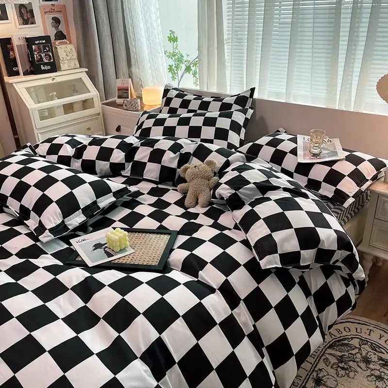 Black checkerboard duvet cover and matching pillowcases styled on a bed