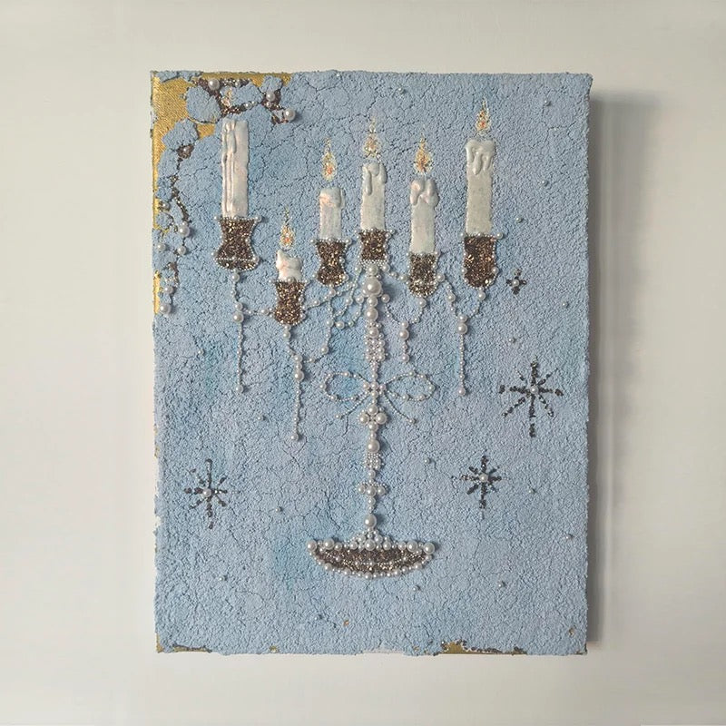 Blue candle canvas wall art with a candelabra and printed pearl details