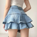 Korean Y2K coquette denim skirt with pleated ruffle design. High-waisted mini skirt for women’s casual and retro styles.