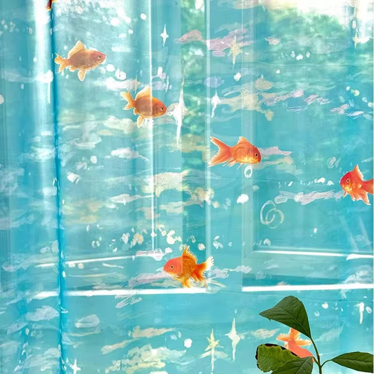 Clear plastic sheet with goldfish and water design, resembling an aquarium.