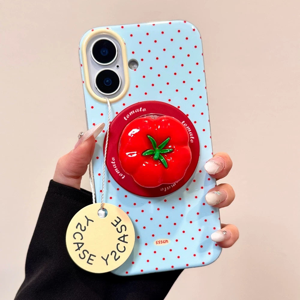 Phone case with tomato design on a wooden table