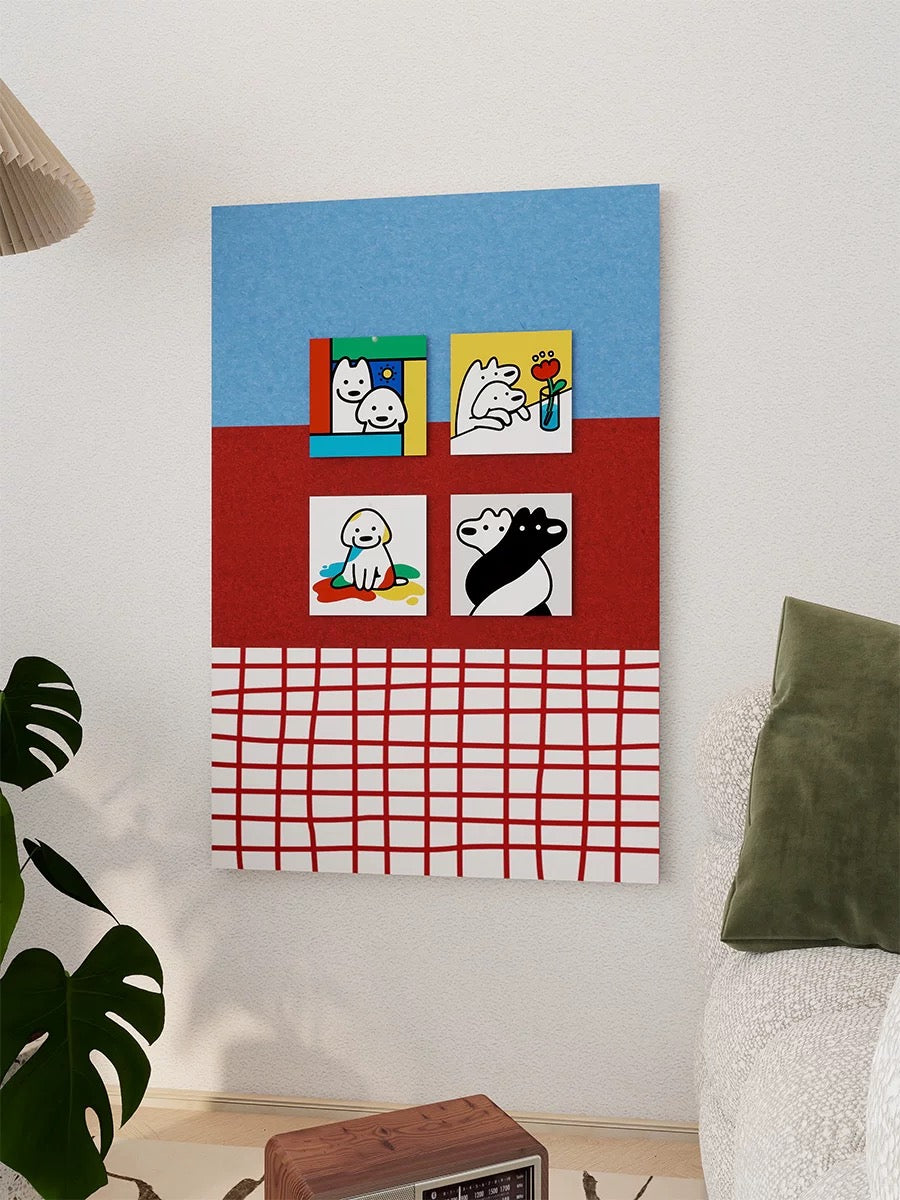 Close view of the blue and red checkered felt pin board with four pinned art cards on a bedroom wall