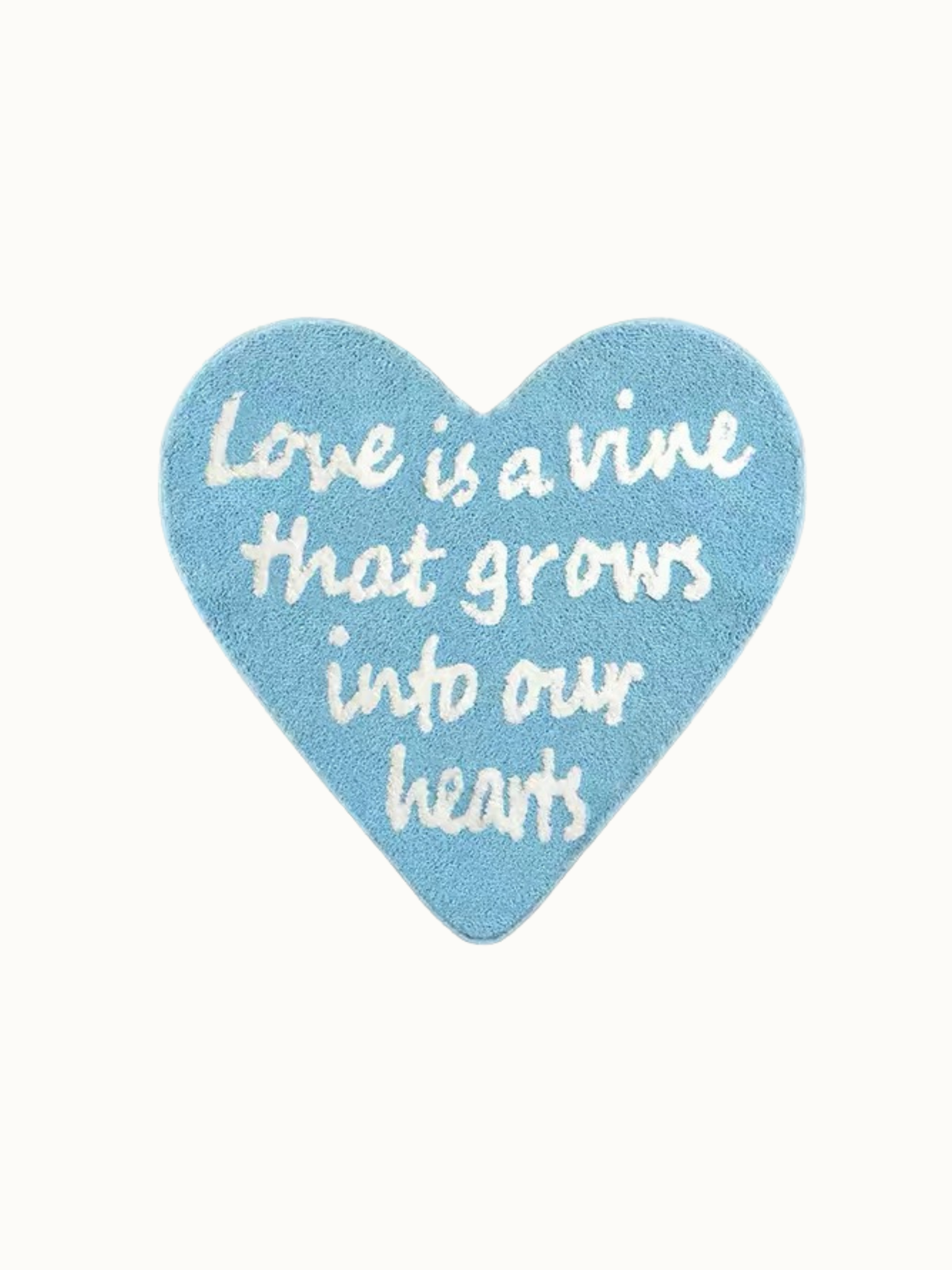 Blue typography rug shown against a plain background, with white lettering running down toward the heart point.
