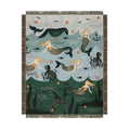 Mermaid-themed blanket with mermaids, octopuses, and sea creatures on a blue and green background.