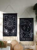 Moon tarot tapestry showing crescent moon with face and stars, framed with floral elements