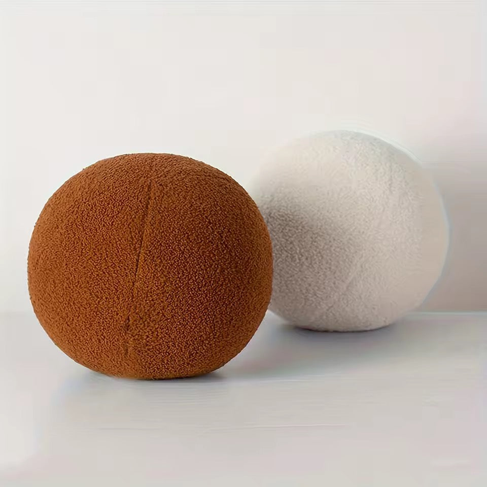 Brown and white textured balls on a light gray background