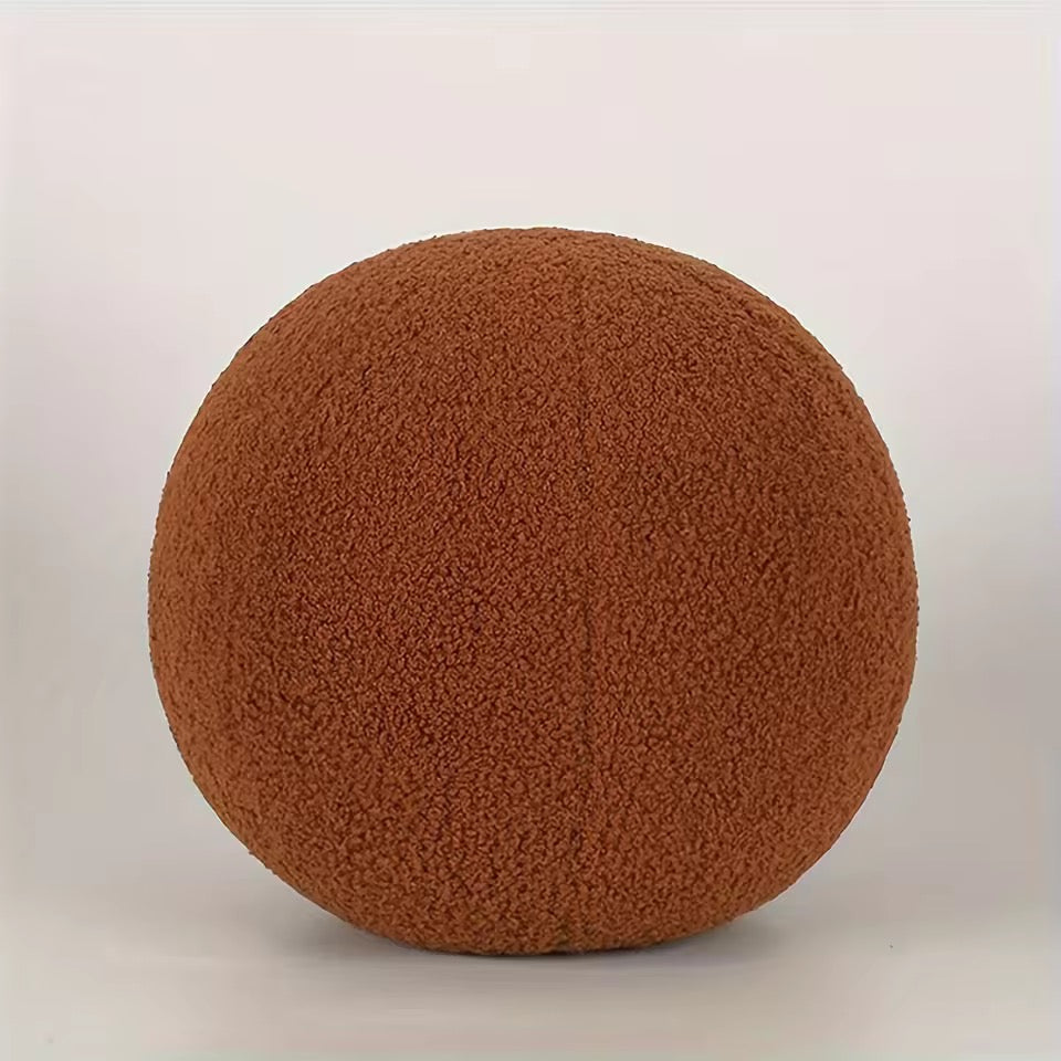 Brown textured ball on a light gray background