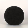 Black boucle cushion on a white background