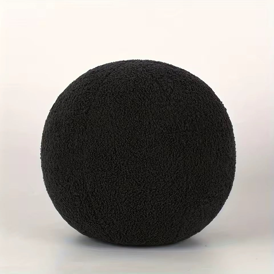 Black boucle cushion on a white background
