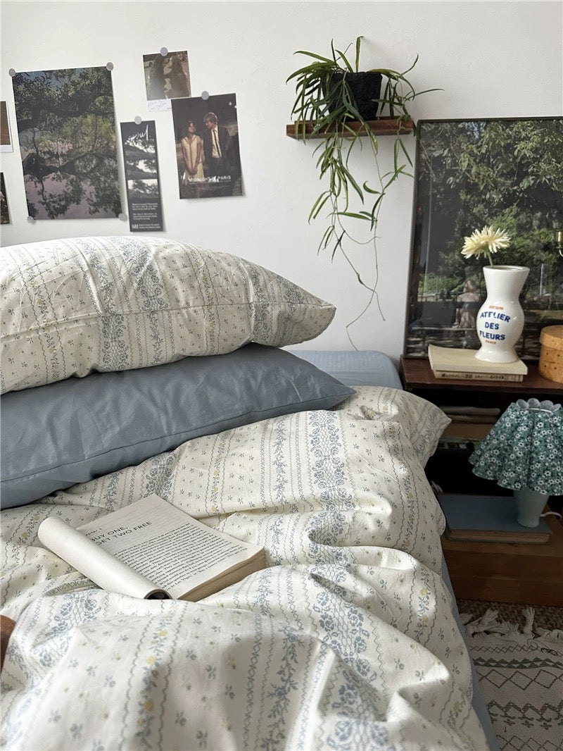 Soft blue floral cotton duvet cover bringing understated European charm to comfortable everyday bedroom styling with texture.