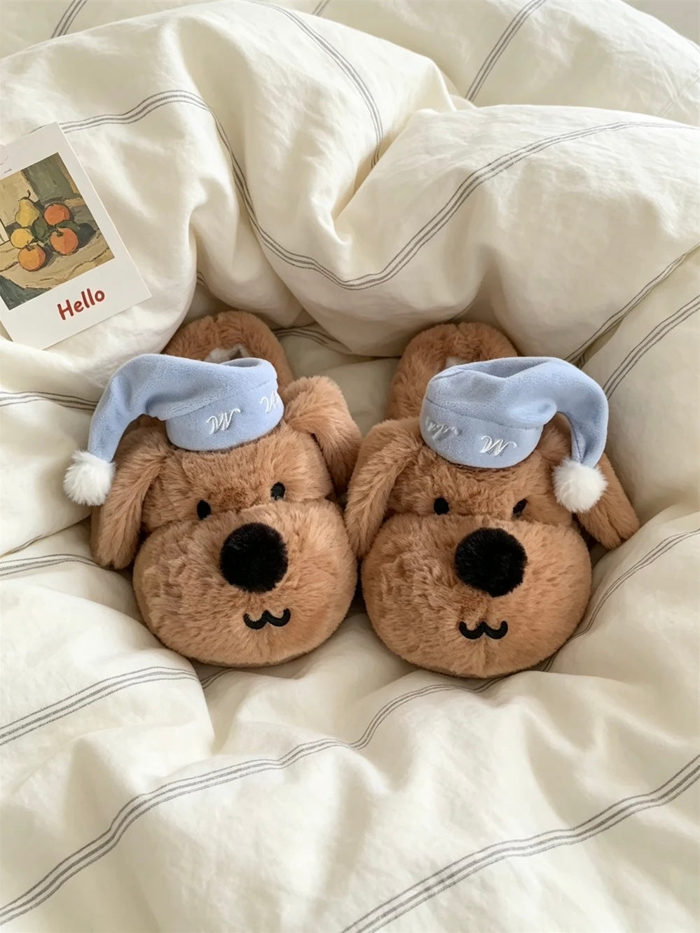 White puppy house slippers displayed under warm indoor lighting