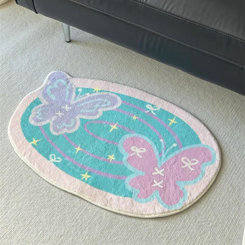 Pastel butterfly and heart bath mats styled together in a soft pink and cream room