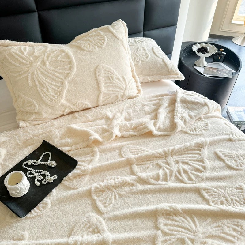 Soft girl style white fleece blanket folded in hand