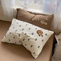 Soft brown fitted sheet with embroidered pillowcases and cozy coffee bedding, ideal for a café‑inspired bedroom makeover