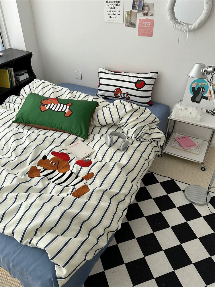 Bed with cartoon-themed bedding in a room with a checkered floor.