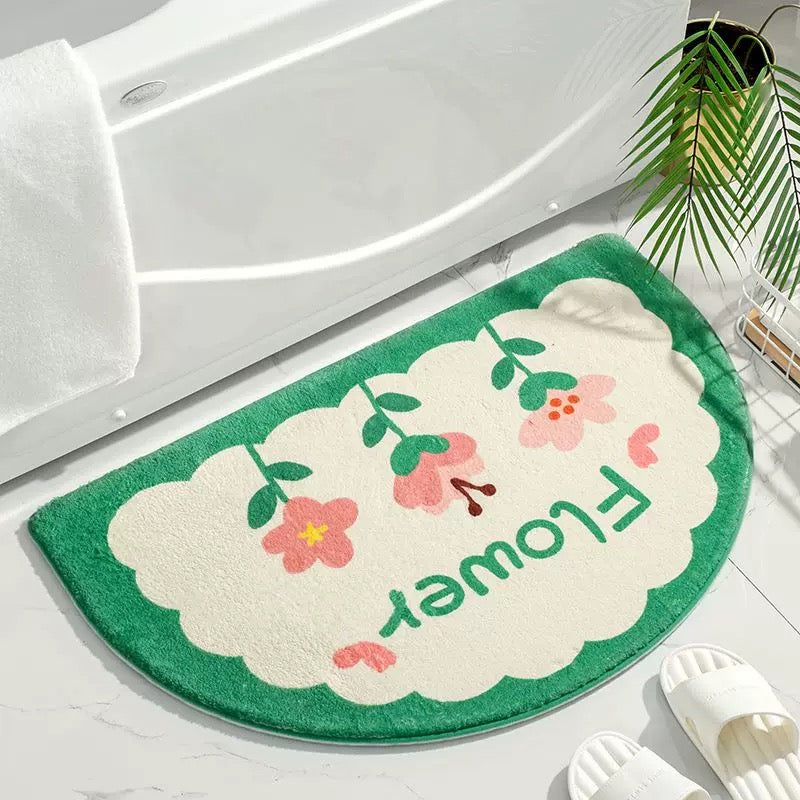 Cozy plush mat next to bathtub with cartoon print