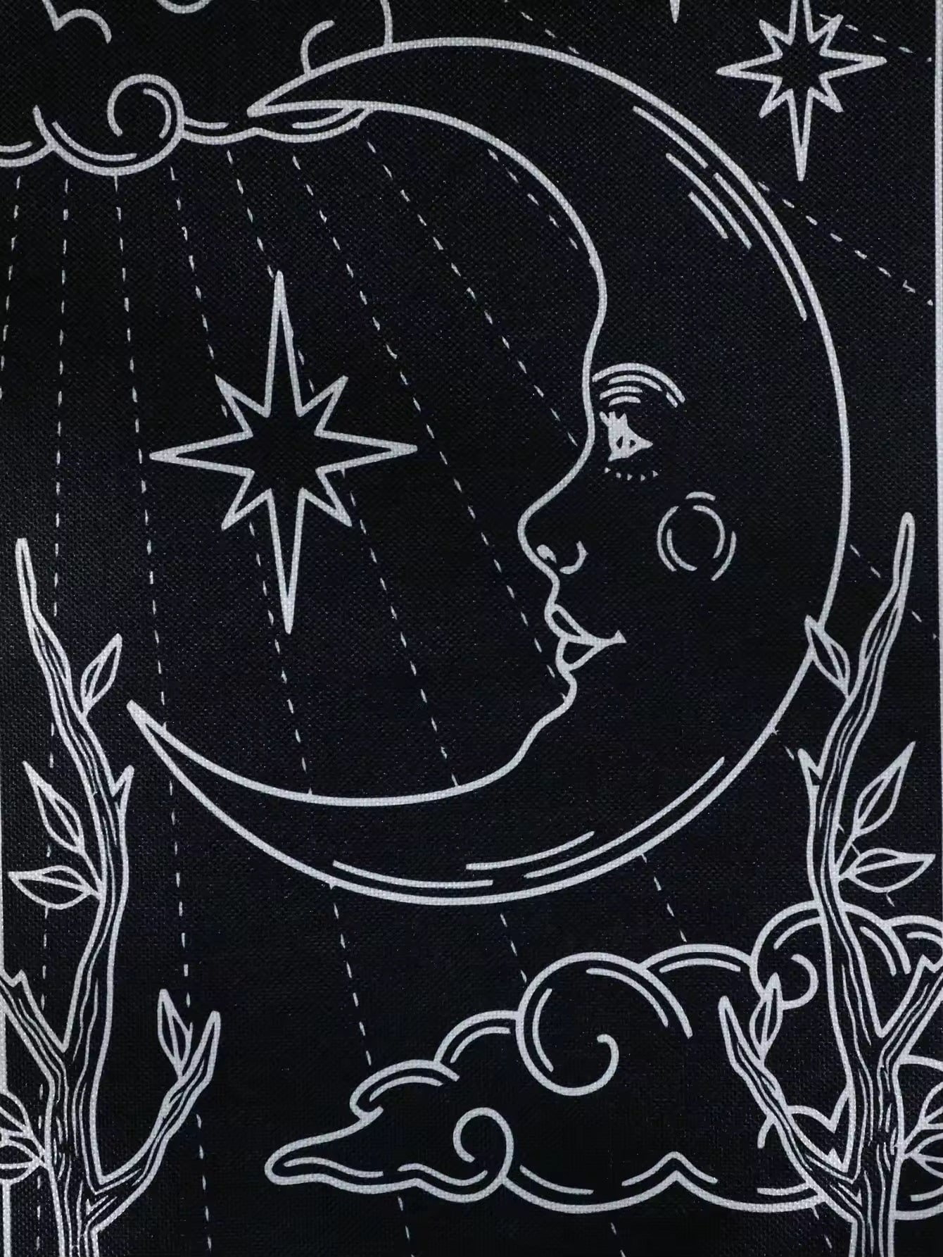 Sun tarot tapestry with radiant beams and sunflowers beneath, accented with cream fringe.