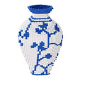 Finished vase displayed on a living room shelf, serving as elegant home decor.
