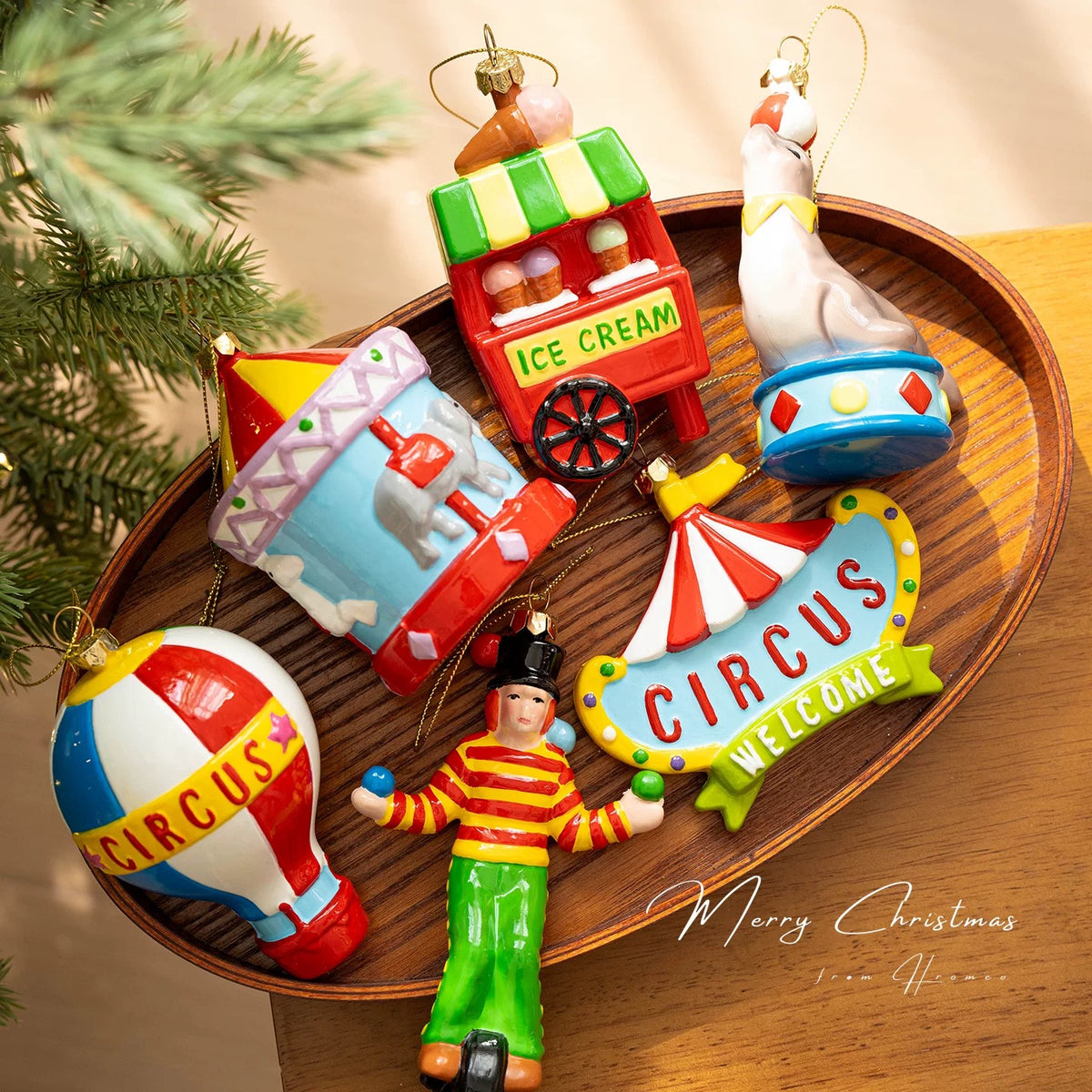 Circus ornaments in six glossy designs include a carousel, clown, seal, balloon, sign and ice cream cart.