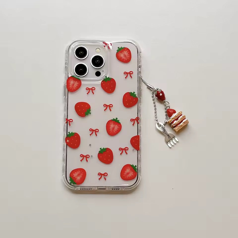 Phone case with strawberry pattern and charm on a light gray background