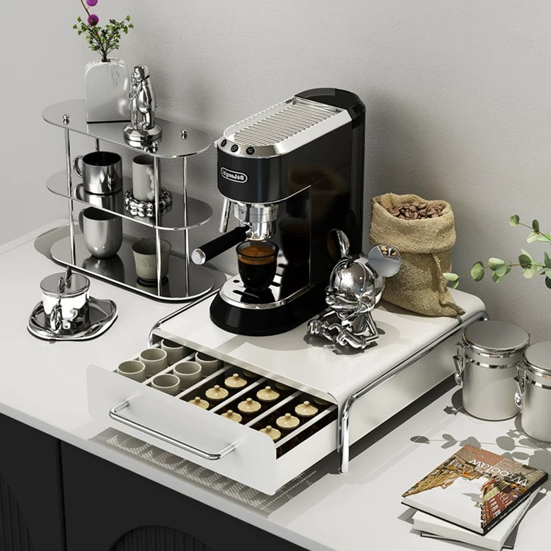 Coffee station organizer placed under a capsule machine, hiding messy packaging and creating a tidy, aesthetic kitchen corner.