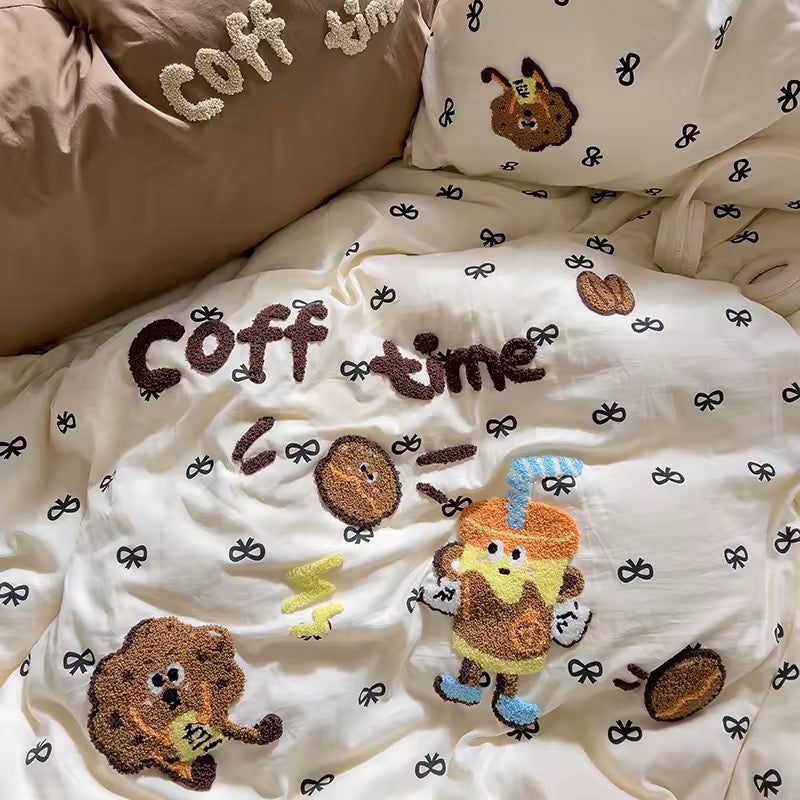 Bed styled like a coffee shop lounge with embroidered duvet and warm tones for café lovers.
