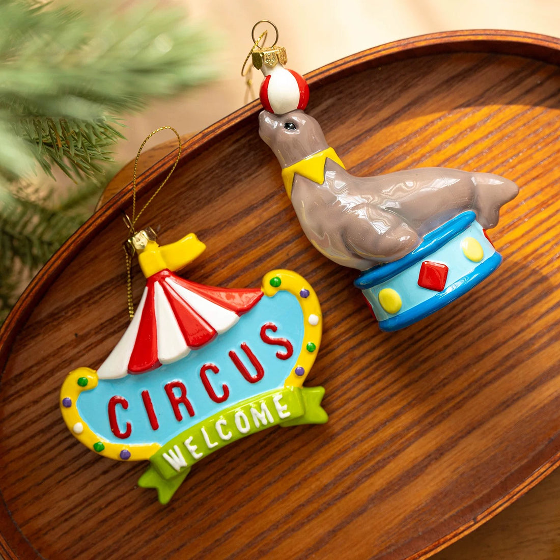 Circus ornaments in six glossy designs include a carousel, clown, seal, balloon, sign and ice cream cart.