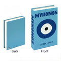 Close-up of pink and yellow faux books with playful cover art, ideal for soft girl dorm decor.