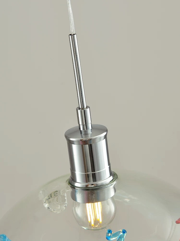 Chrome pendant light fixture on a neutral background