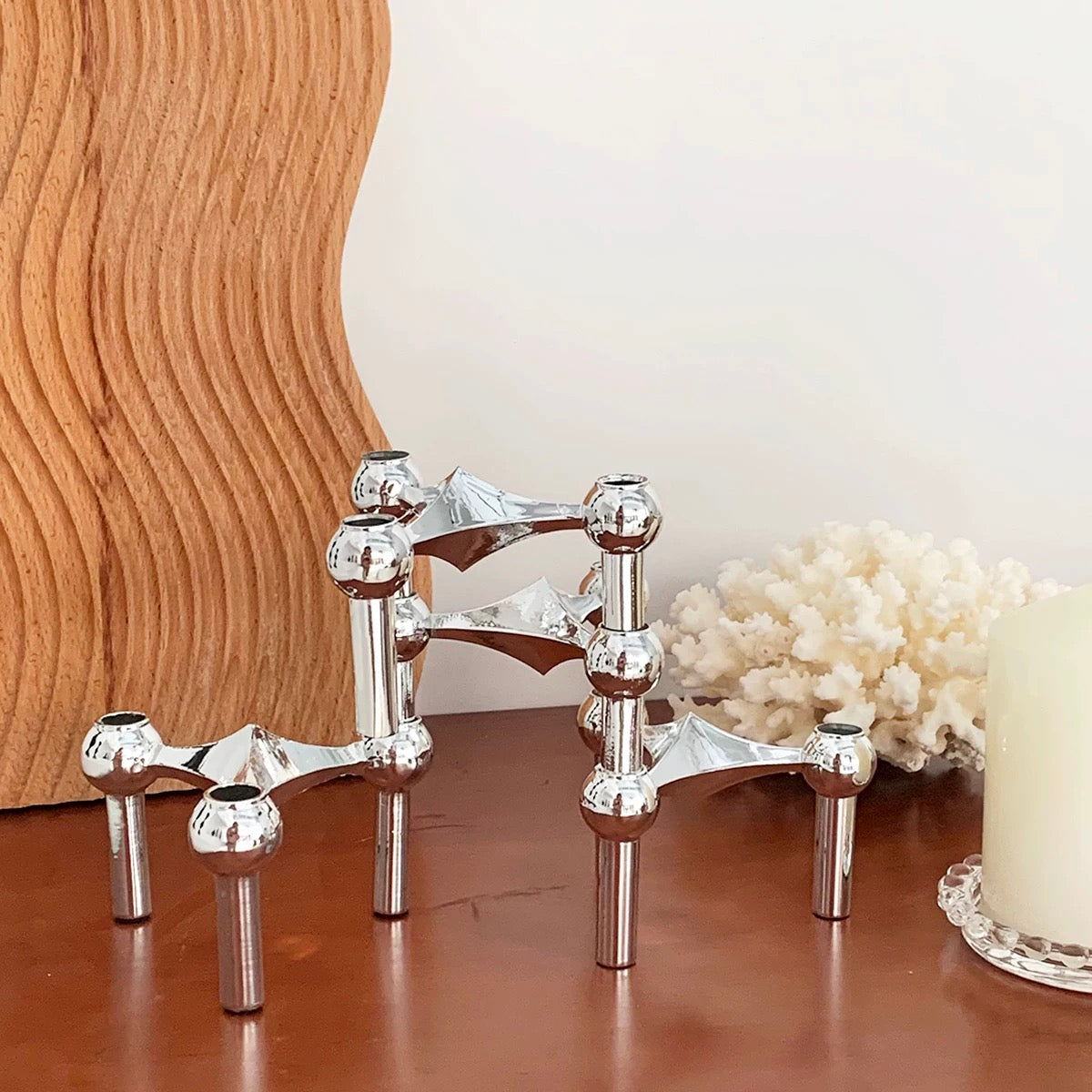 The candlestick in a living room, enhancing the contemporary ambiance.