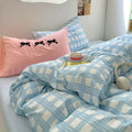 Aesthetic sky blue checked bedding styled with pink bows pillow – perfect for Korean dorm rooms