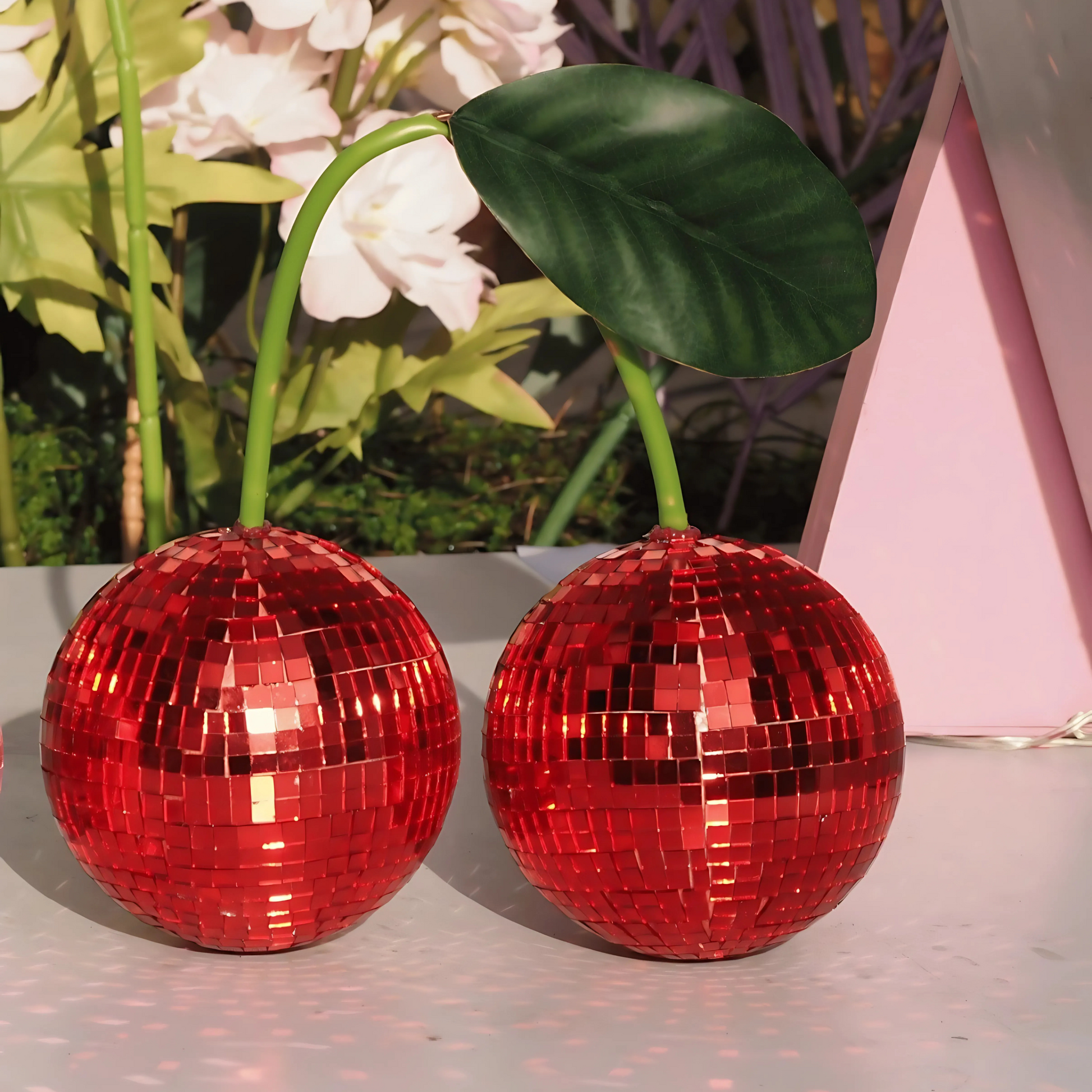 Fruitcore cherry mirror ball decor on wooden table