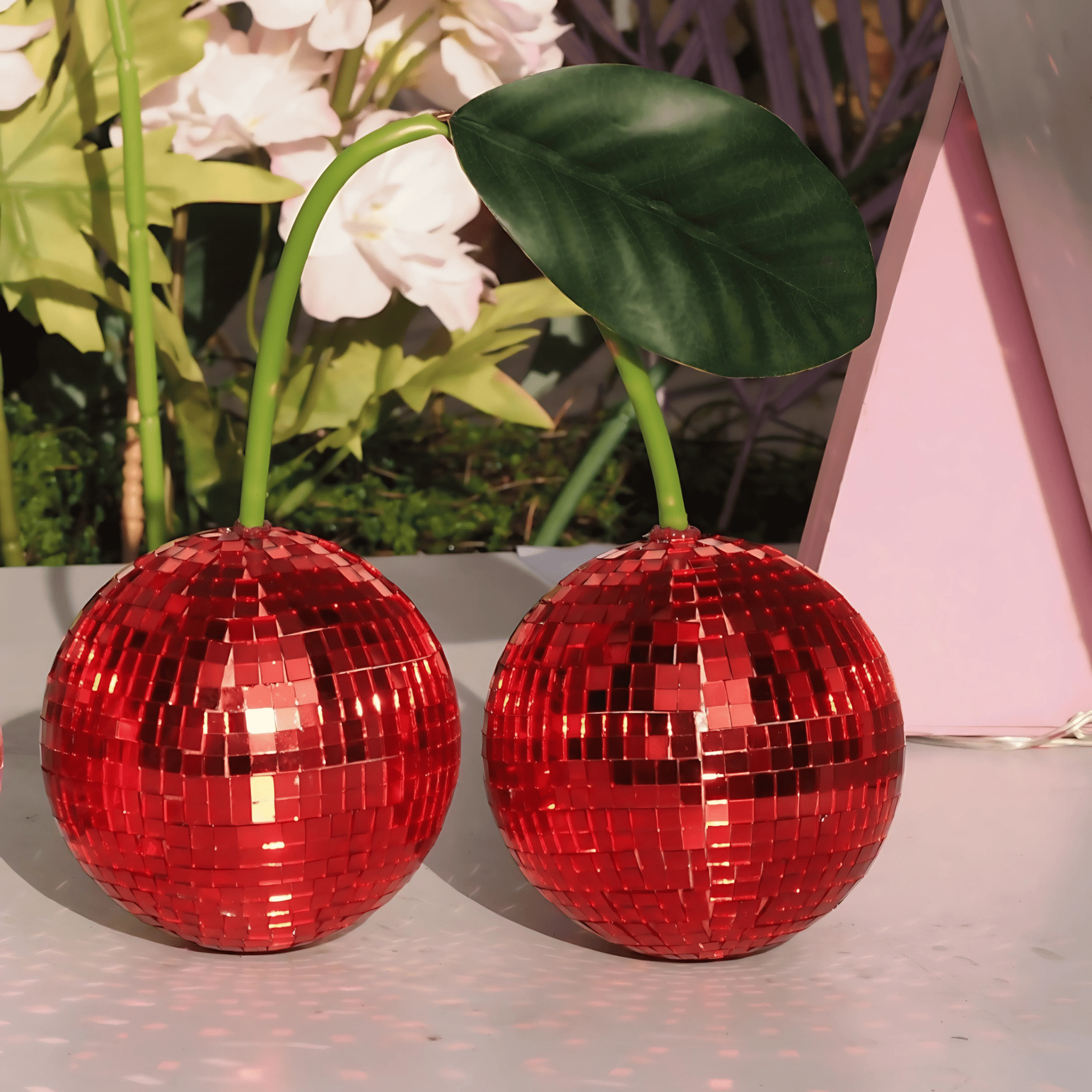 Fruitcore cherry mirror ball decor on wooden table