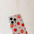 Phone case with strawberry and bow pattern on a white background
