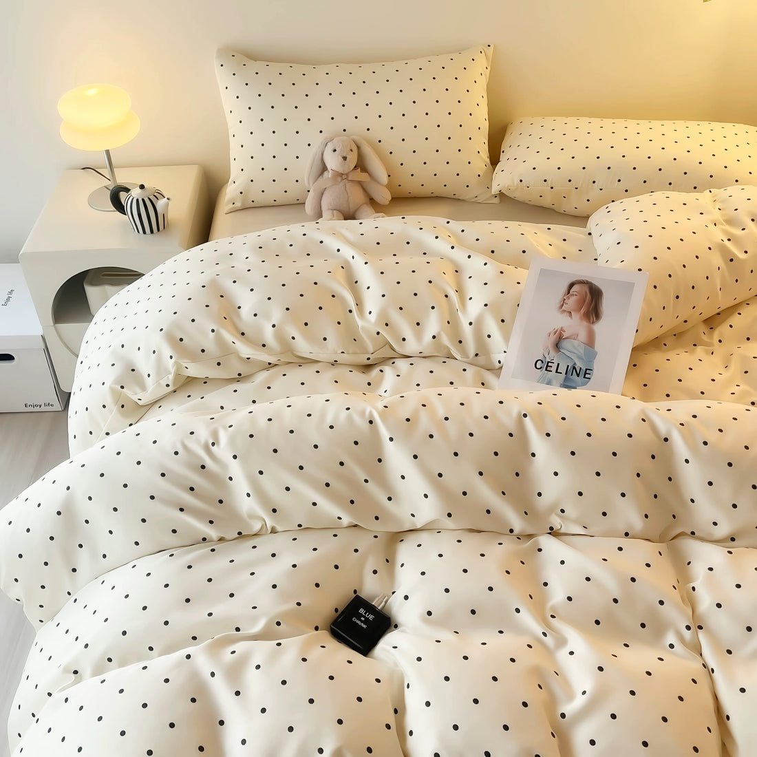 Summer satin duvet cover set with playful black dot polka design.