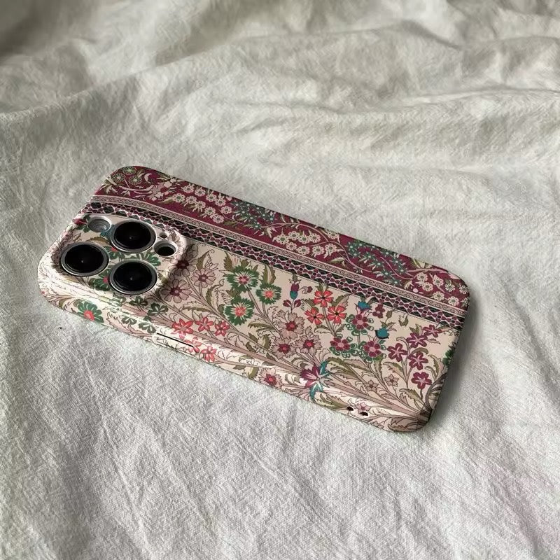 Close-up of the ethnic floral iPhone case showcasing intricate patterns and vibrant colors.