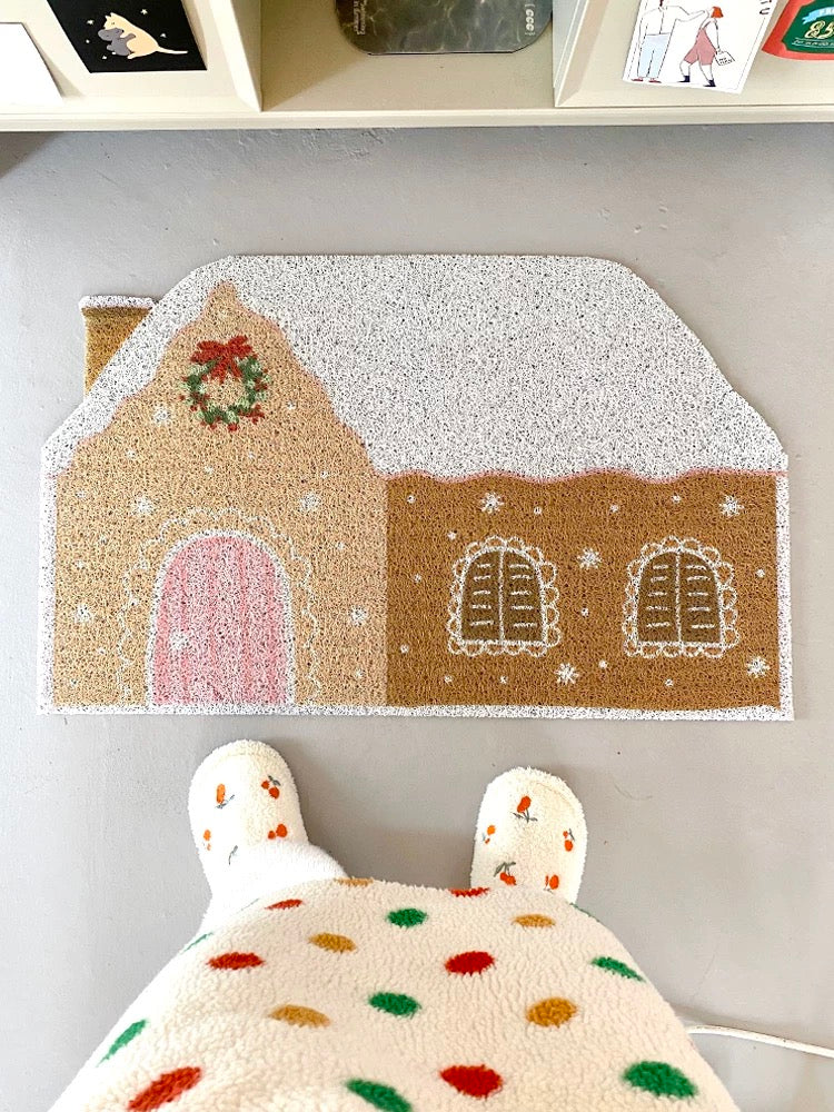 Cream gingerbread doormat styled at the doorway of a cozy bedroom