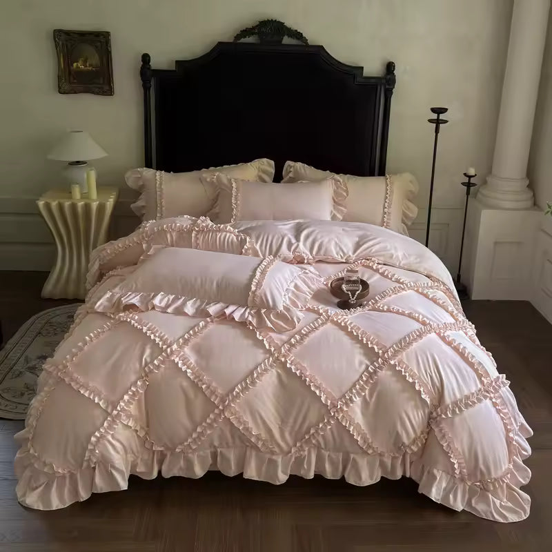 Full view of white lace ruffle bedding with quilted square pattern design.