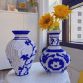 Children and adults collaboratively building the vase, emphasizing family-friendly activity.