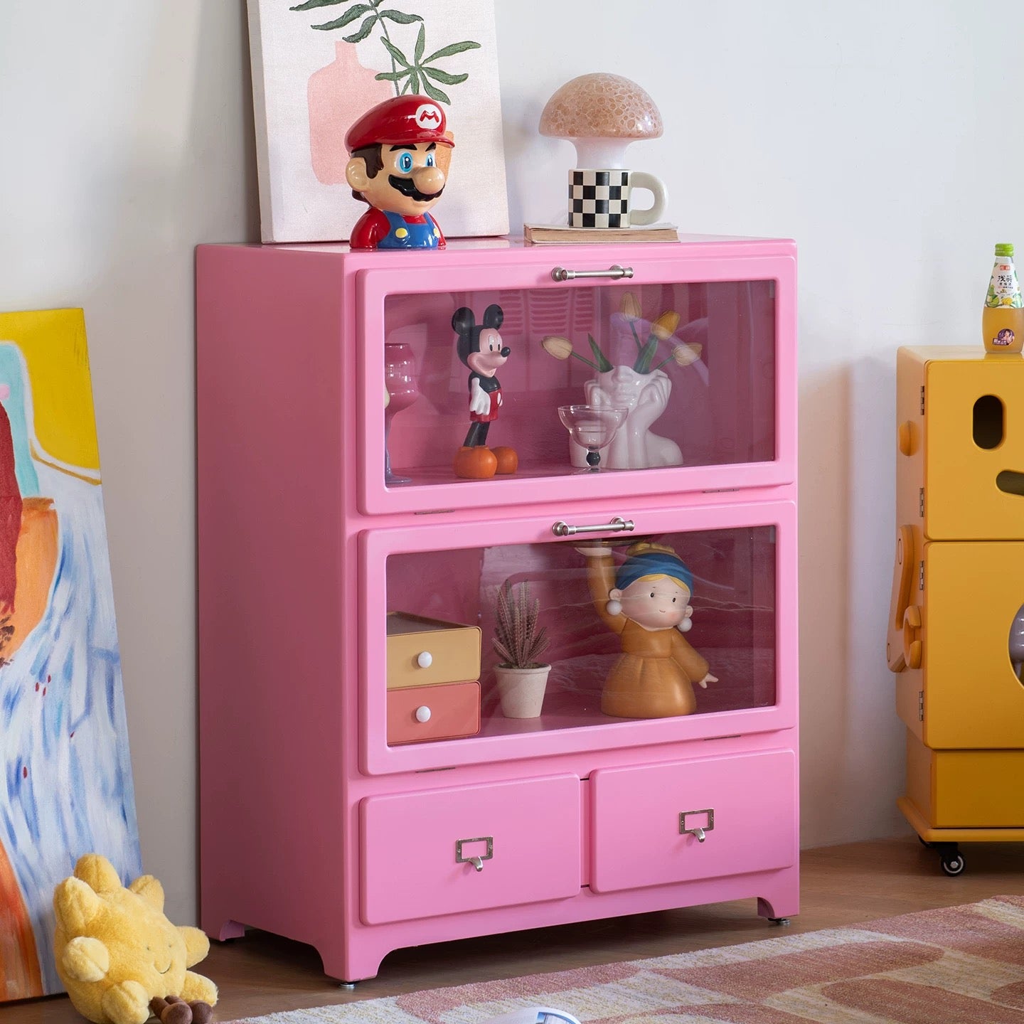 Pink dopamine storage cabinet displaying collectibles while adding cute aesthetic vibes to room