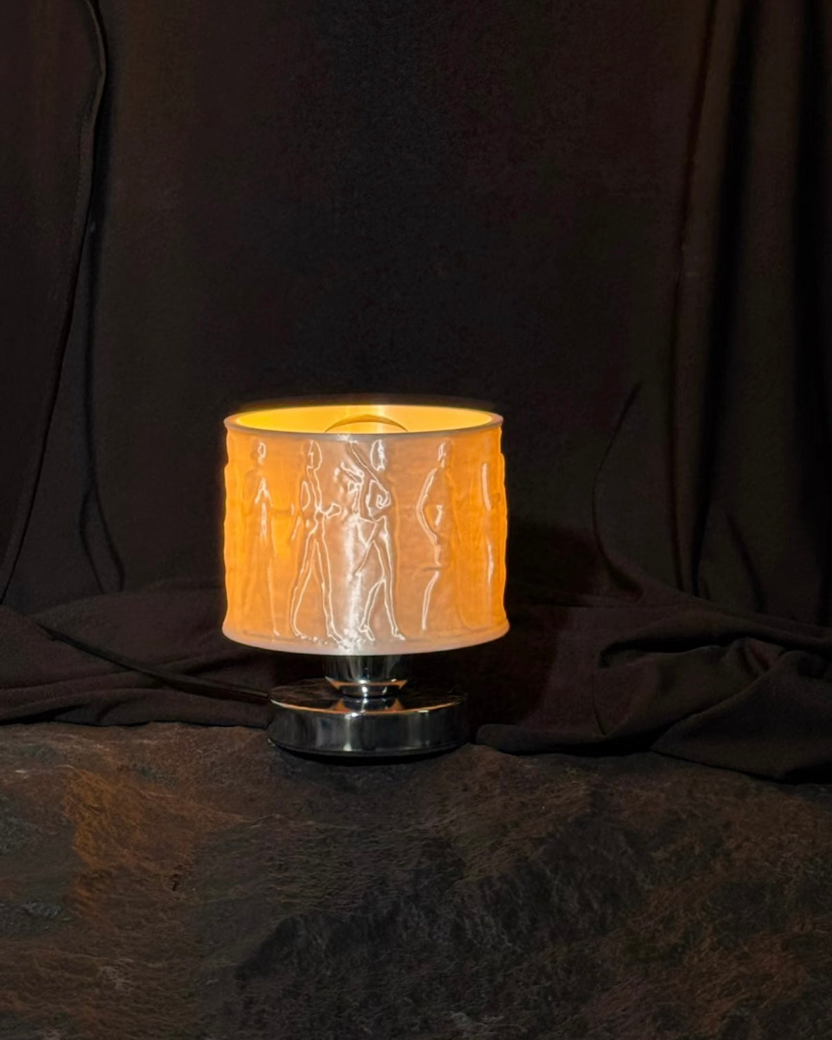 Modern relief art lamp perfect for bedside reading and ambient bedroom lighting
