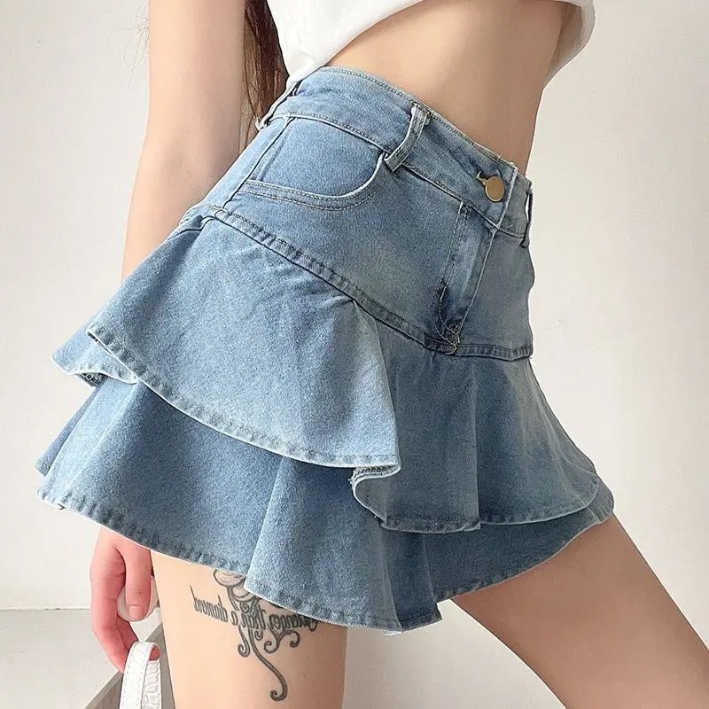 High-waist blue denim mini skirt with ruffle details and slim fit. Korean fashion Y2K style for casual and streetwear outfits.