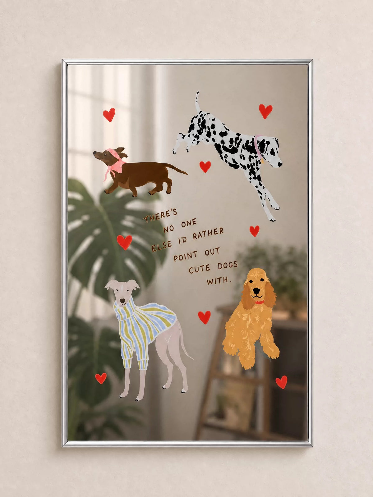 A dog print wall mirror shows four illustrated dogs and red hearts, with reflections visible between the graphics.