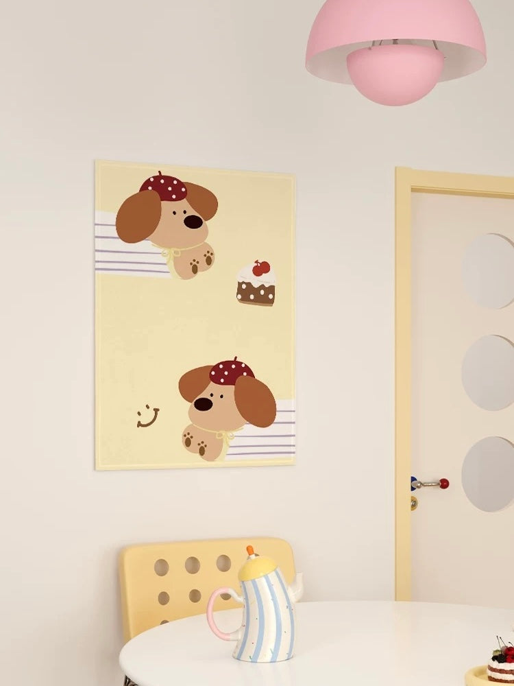 A dog tapestry shows two brown puppies in red hats and striped shirts on a pale yellow ground above a chair.