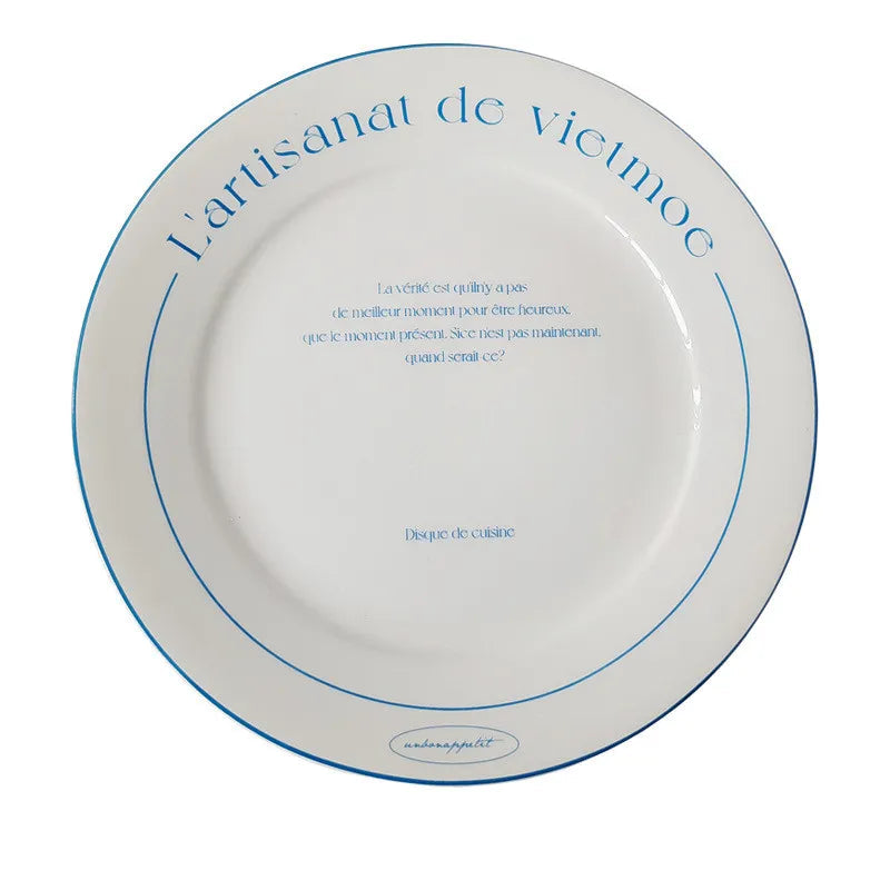 A white ceramic dinner plate with blue printed text and border lines, shown from above on a white background with a 20.5cm size label below.